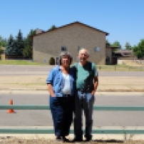 Here, Mom and Dad are standing in the parking lot of their first apartment, and the building behind them across the street is the church where they were married. The day of their wedding, they were both very sick, and they walked across the street for a simple wedding attended only by Chris and a work colleague of Dad's who had agreed to serve as a witness.